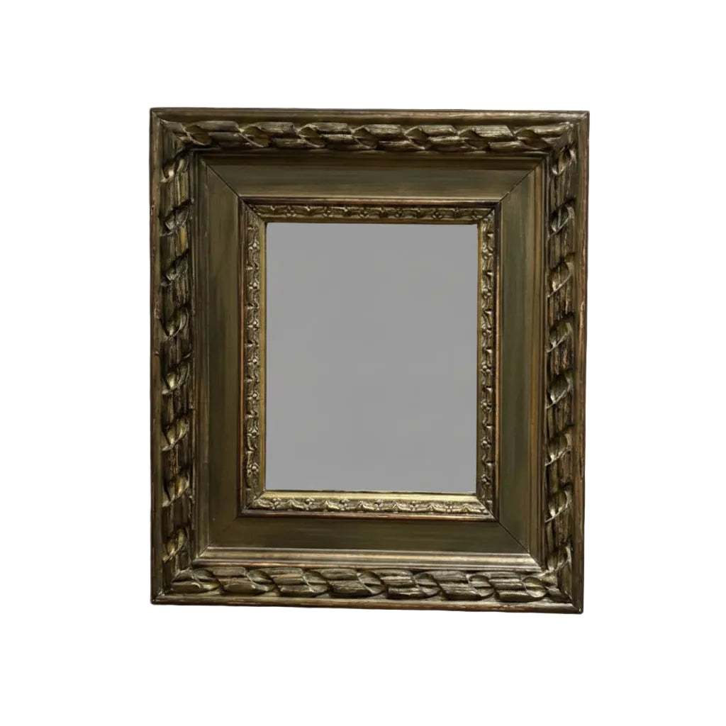 Small vintage mirror in a carved gilt frame with braided molding, front view