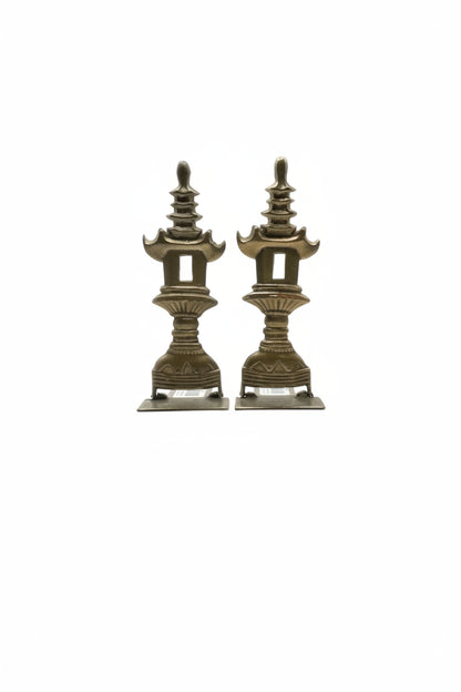 Pair of vintage brass pagoda-form bookends, front view on white background