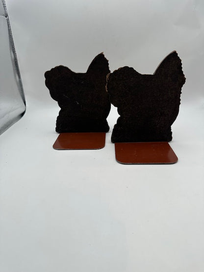 Rear silhouette view of the carved wood sailfish bookends on metal base plates