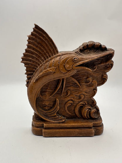 Close-up of the carved and stippled dorsal fin on the wood sailfish bookend
