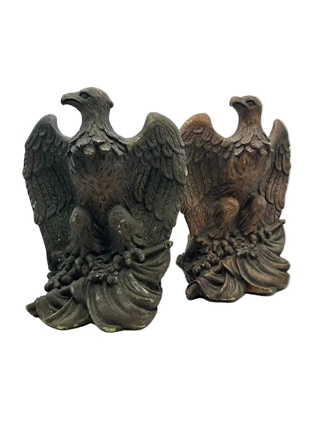 Pair of cast eagle bookends with spread wings, one dark verdigris and one bronze finish