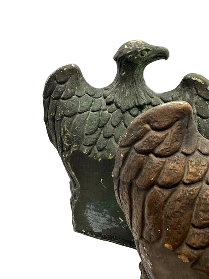 Two eagle bookends side by side showing green and bronze patinas