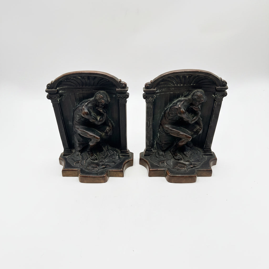 Vintage pair of bronze-clad 'The Thinker' bookends with arched columned frames, front view