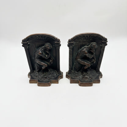 Vintage pair of bronze-clad 'The Thinker' bookends with arched columned frames, front view