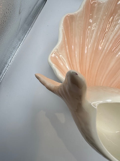 Close-up of the fish-form bowl and shell base of the peach lustreware serving piece