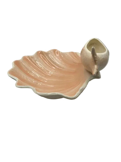 Angled view of the peach lustre shell dish with fish-form bowl, from above