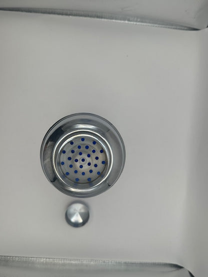Top view of cocktail shaker's chrome strainer lid