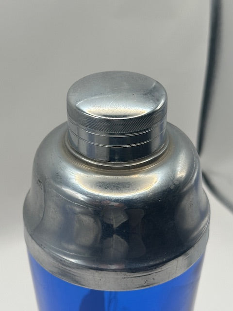 Close-up of the chrome screw cap and lid on the cobalt sailboat cocktail shaker