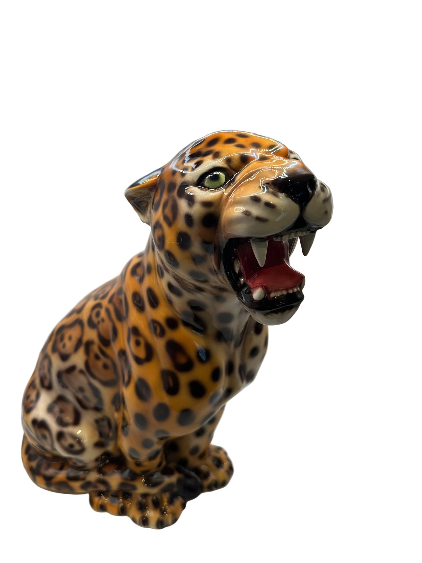 Front three-quarter view of the majolica leopard showing its open roaring mouth and green eyes