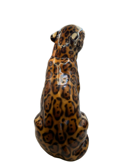 Rear view of the majolica-style leopard figure showing the spotted glazed back