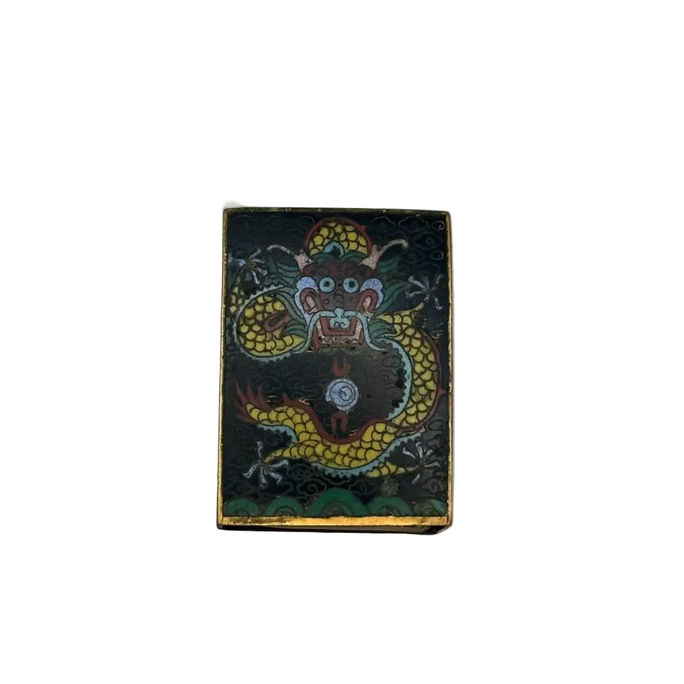 Close-up front of the black cloisonne cover detailing the colorful dragon and flaming pearl