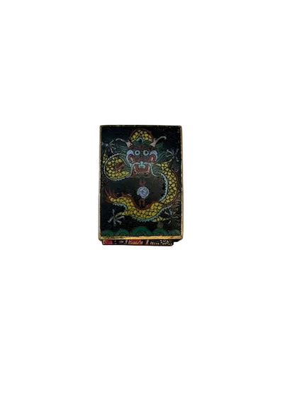 Vintage cloisonne matchbox cover with a gold dragon chasing a flaming pearl on black enamel