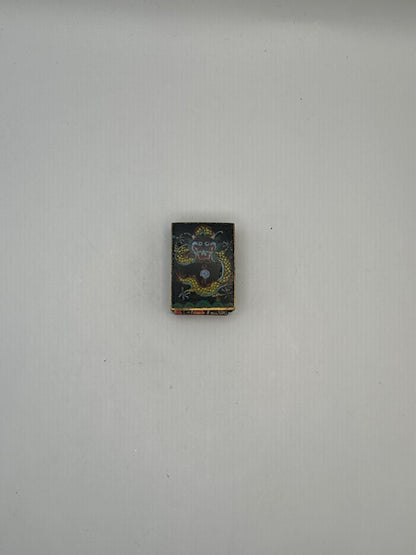 Black dragon cloisonne matchbox cover shown small on a white background, alternate view
