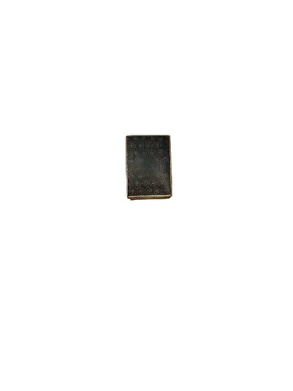Worn edge view of the black dragon cloisonne matchbox cover showing enamel loss