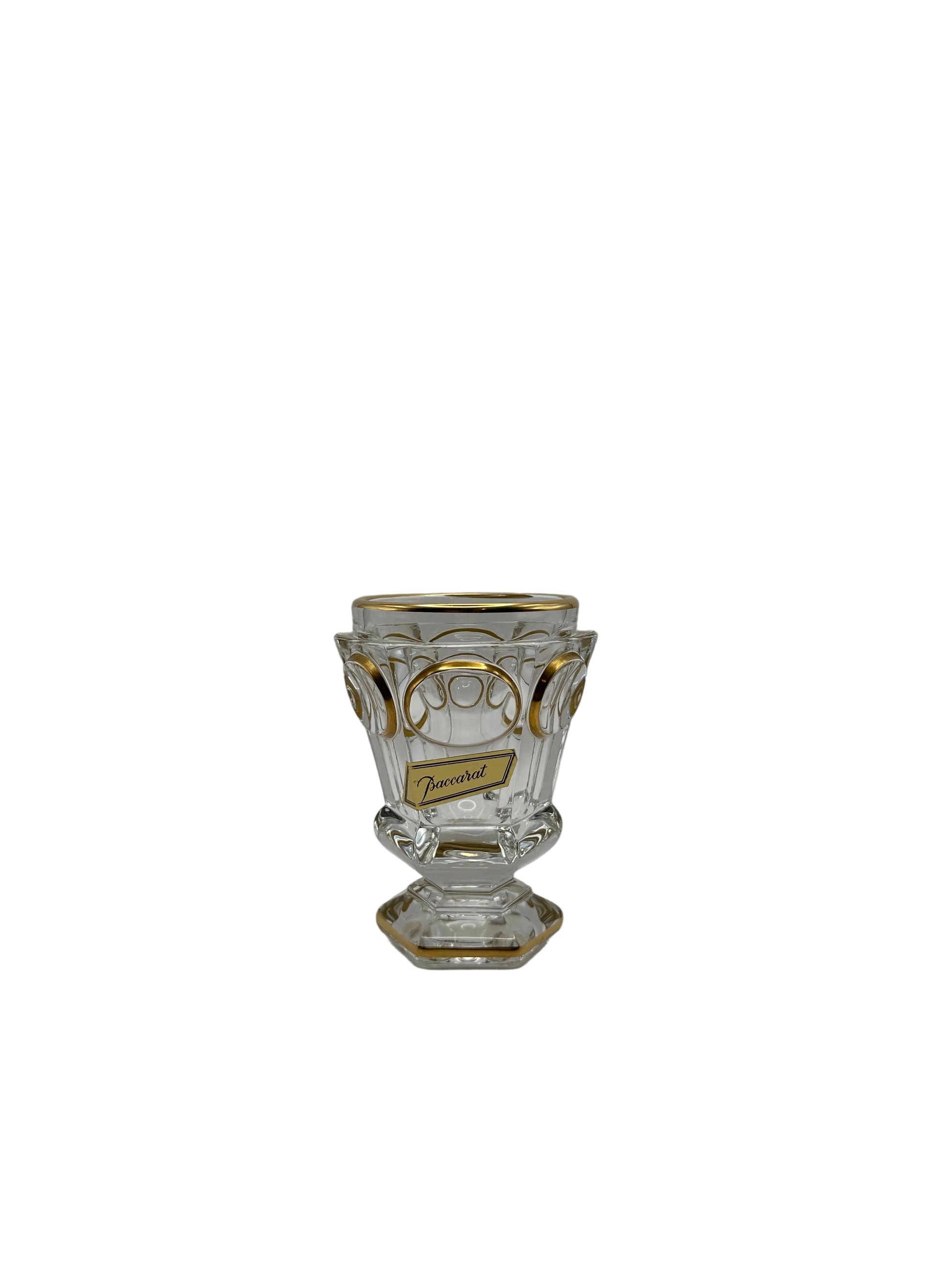 Baccarat crystal vase showing a gilt script maker's label on the gold-decorated faceted body