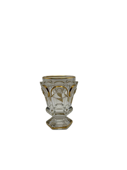 Baccarat crystal footed vase with gilt arches and panels, full front view on hexagonal pedestal base