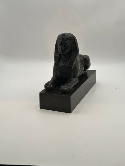 Vintage Egyptian Revival bronze sphinx statue, three-quarter front view on black base