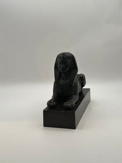 Vintage Egyptian Revival bronze sphinx statue, front view showing pharaoh face and forepaws