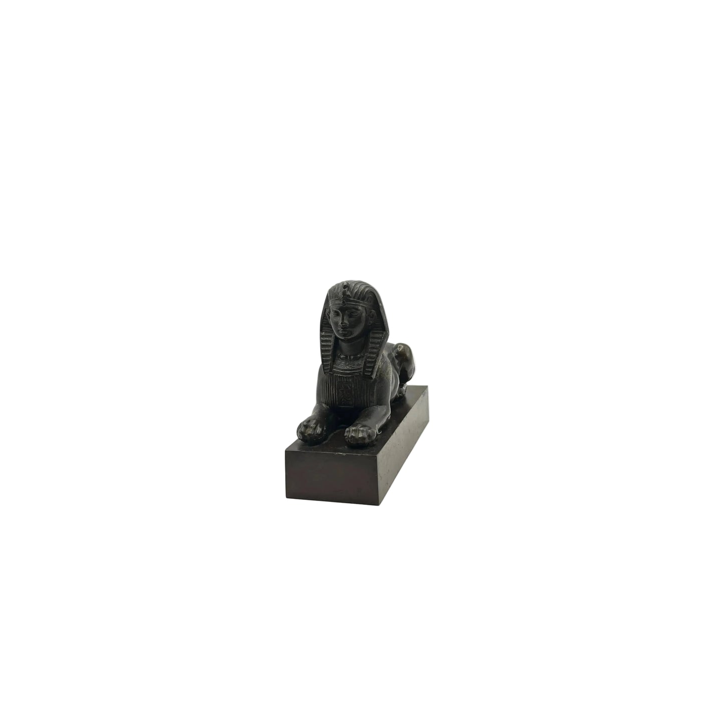 Vintage Egyptian Revival bronze sphinx statue on black base, three-quarter view