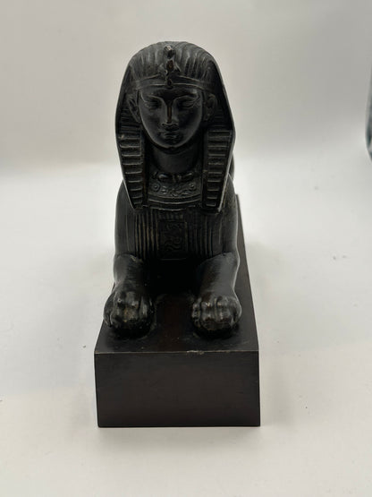 Vintage Egyptian Revival bronze sphinx, head-on close view of face, headdress and forepaws