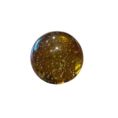 MCM amber controlled-bubble glass sphere, slightly angled view on white background