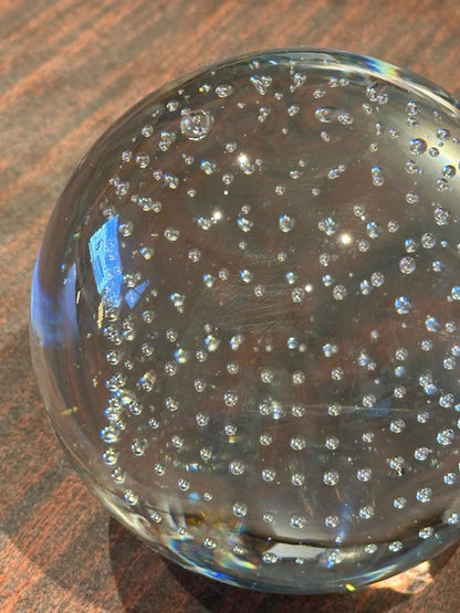 Top-view close-up of MCM controlled-bubble glass sphere showing columns of suspended bubbles