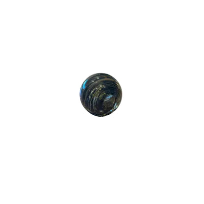Smoky swirl controlled-bubble glass sphere shown on a white background