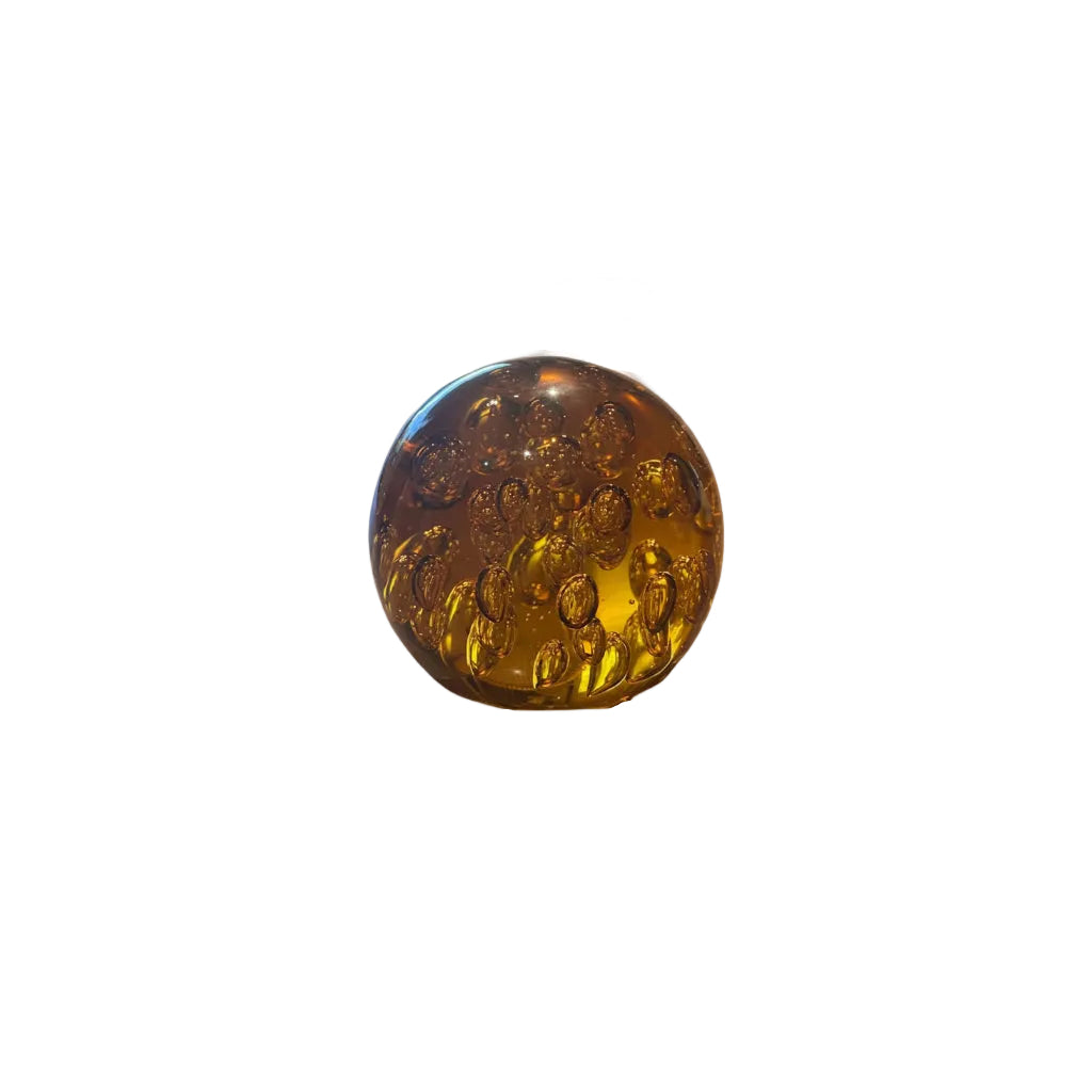 MCM amber controlled-bubble glass sphere with rising bubbles, on white background