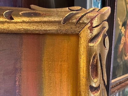 Close-up of ornate carved gilt frame corner on vintage still life painting