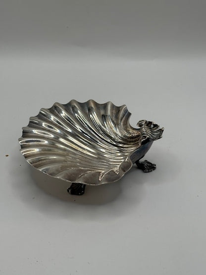 Vintage silver plate shell dish, angled side view of footed scallop bowl