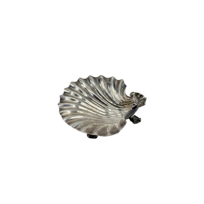 Vintage silver plate shell dish, angled view on claw feet with figural dolphin handle