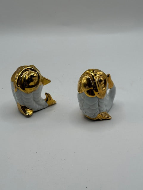 Vintage fish salt and pepper set, angled view of the two gold-headed porcelain fish