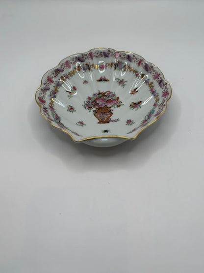 Chinese porcelain floral dish, angled view of scalloped interior with painted floral border