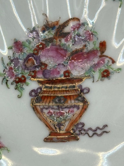 Close-up of the central hand-painted flower-basket motif on the Chinese porcelain dish