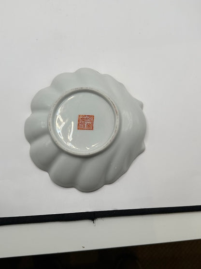 Underside of the Chinese porcelain dish showing the red painted seal mark