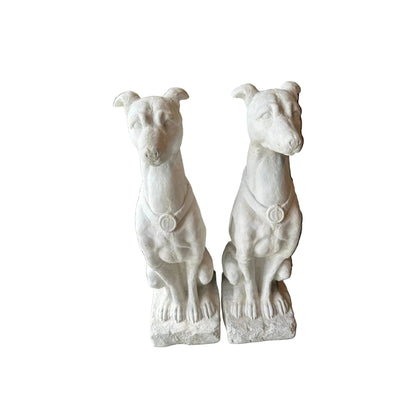 Pair of white plaster greyhound statues seated upright with medallion collars, front view