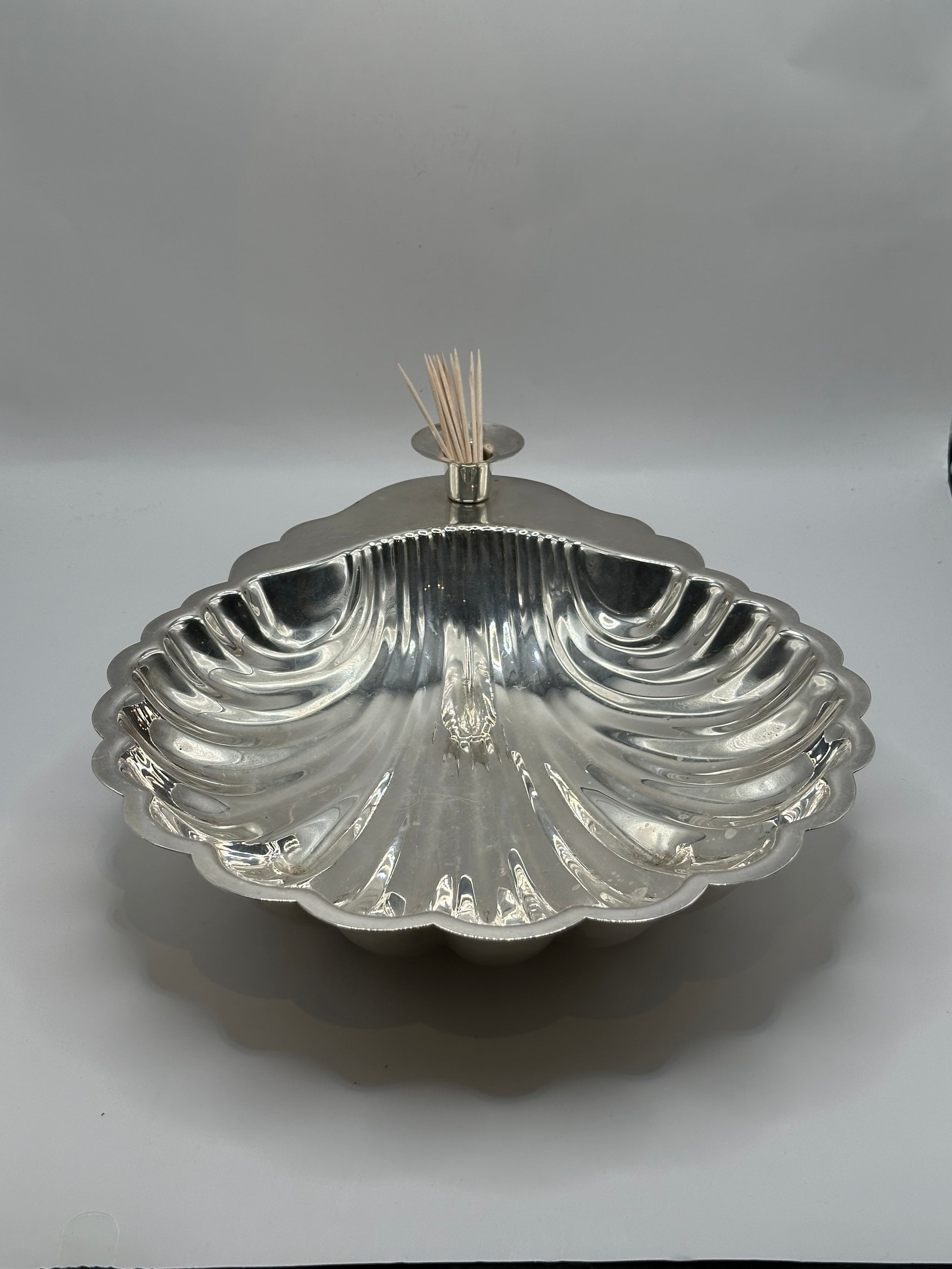 Sheridan shellfish server raised on its pedestal foot, toothpicks fanned from the center socket