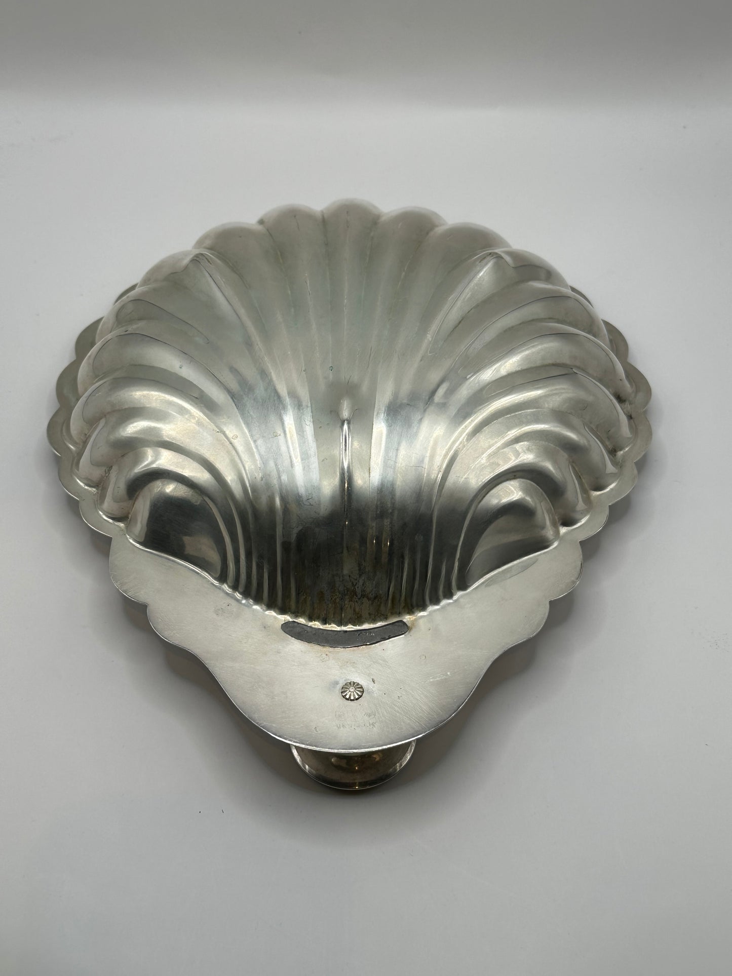 Sheridan shellfish server, overhead view of scalloped interior with central socket and scroll foot