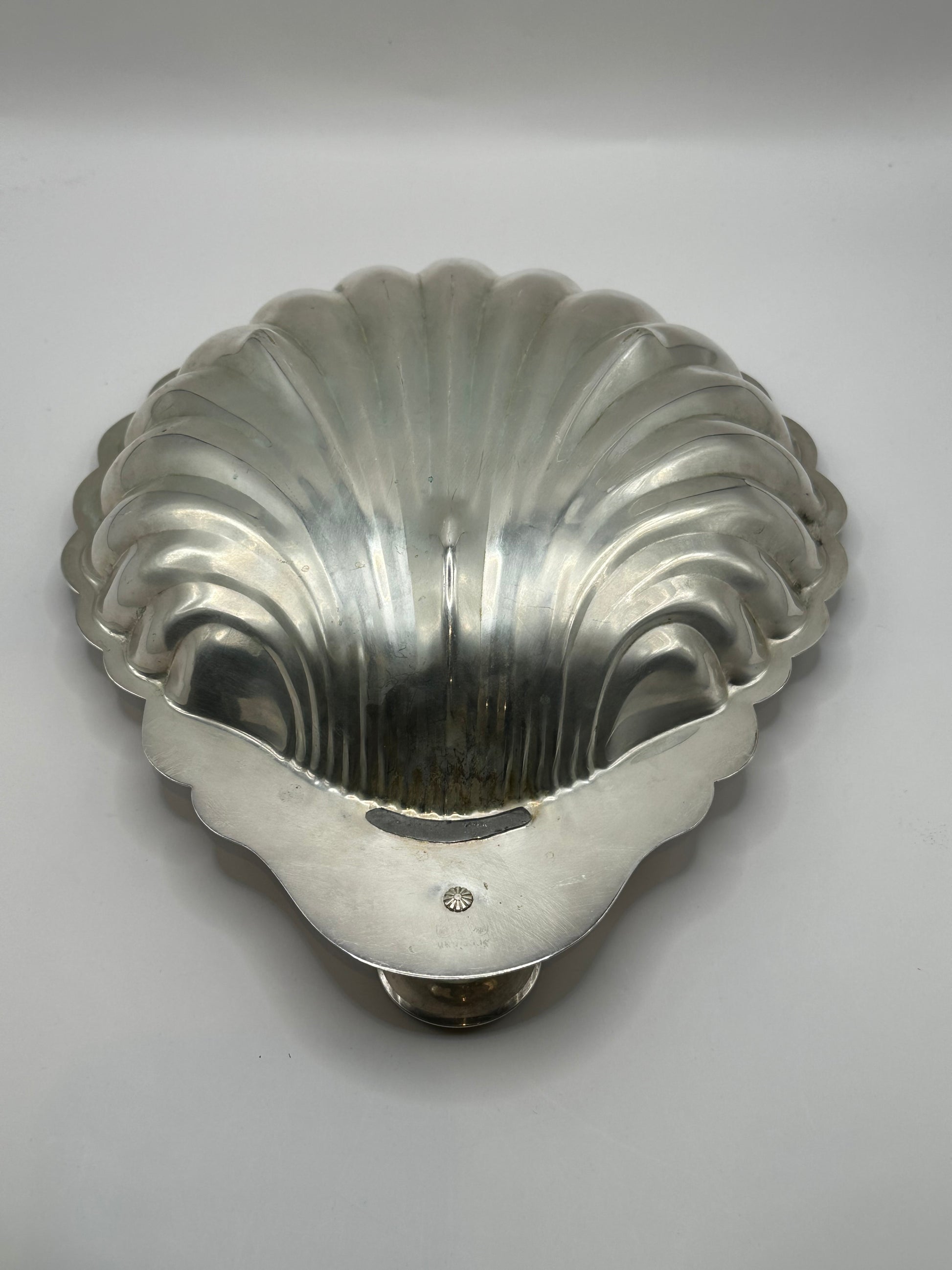 Sheridan shellfish server, overhead view of scalloped interior with central socket and scroll foot