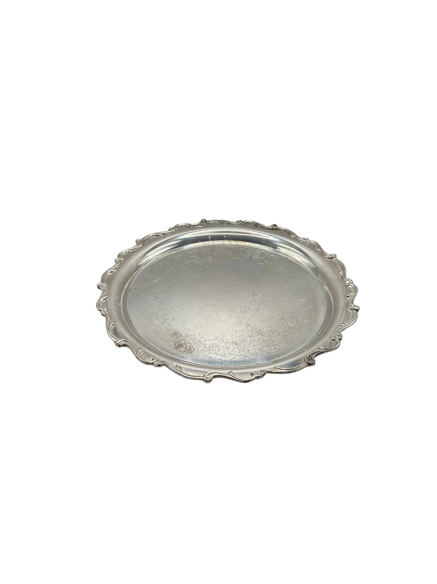 Silver-plate serving tray, top view of scalloped ornate rim