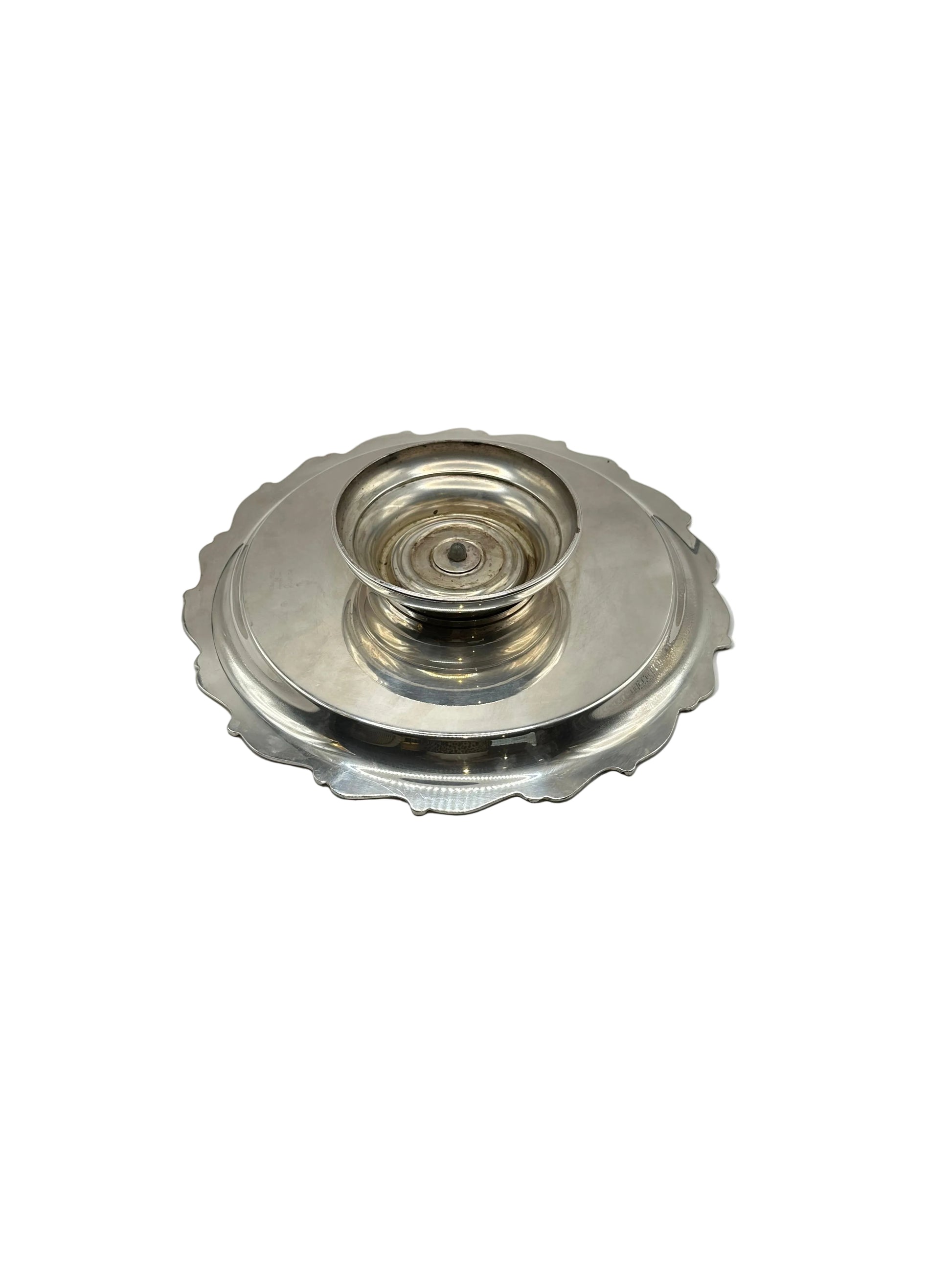 Underside of the silver-plate tray showing its rotating pedestal base