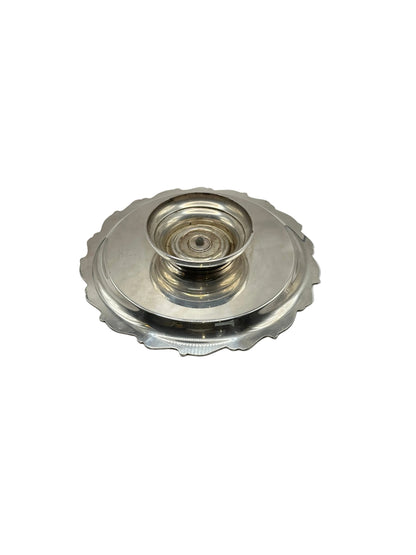 Underside of the silver-plate tray showing its rotating pedestal base