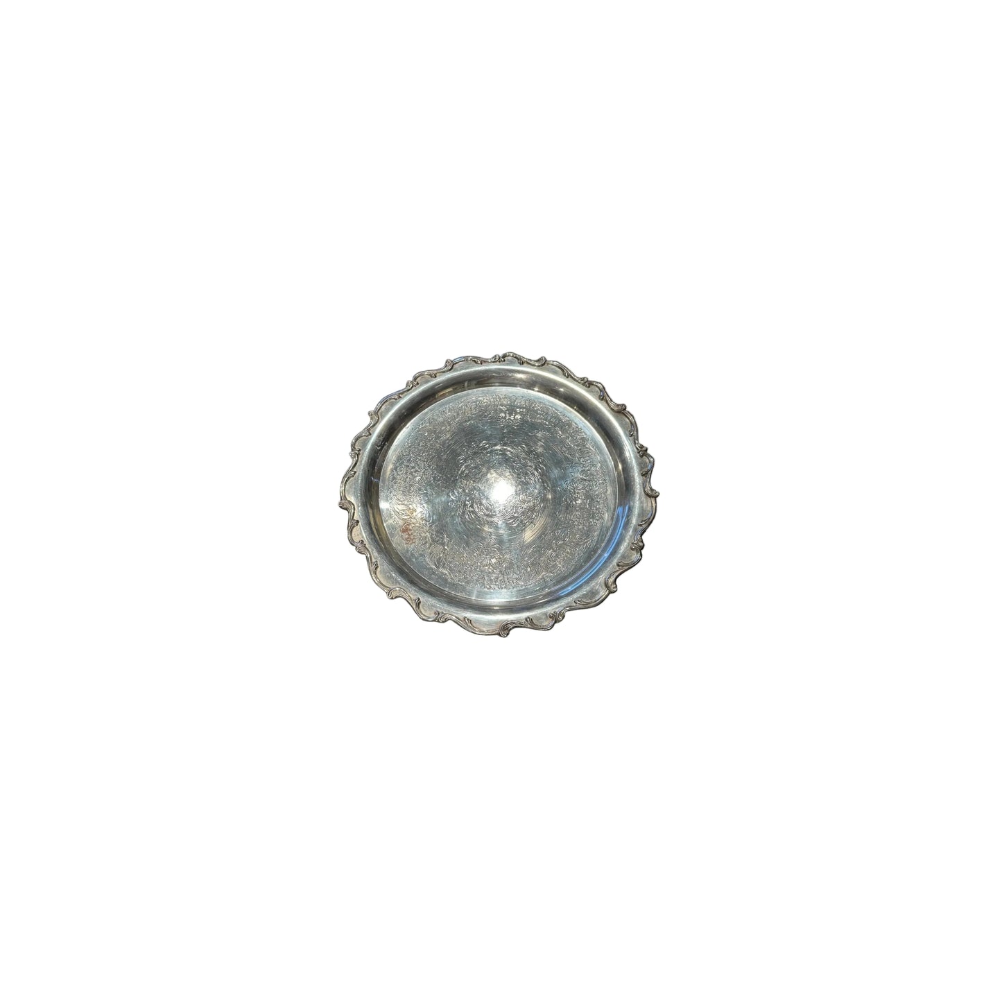 Silver-plate scalloped serving tray viewed top-down
