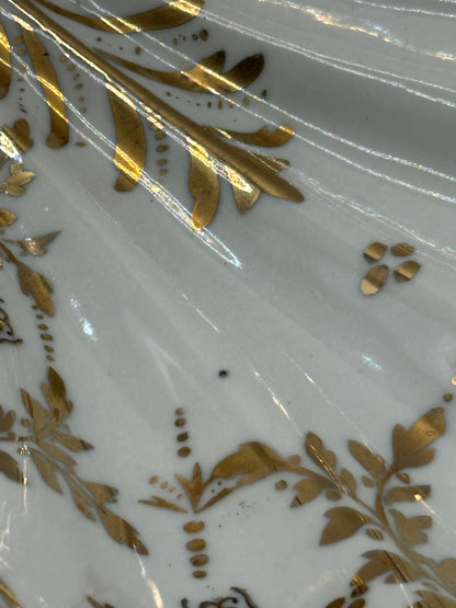 Close-up of the Vintage Limoges shell dish's gilt hand-painted floral and leaf decoration
