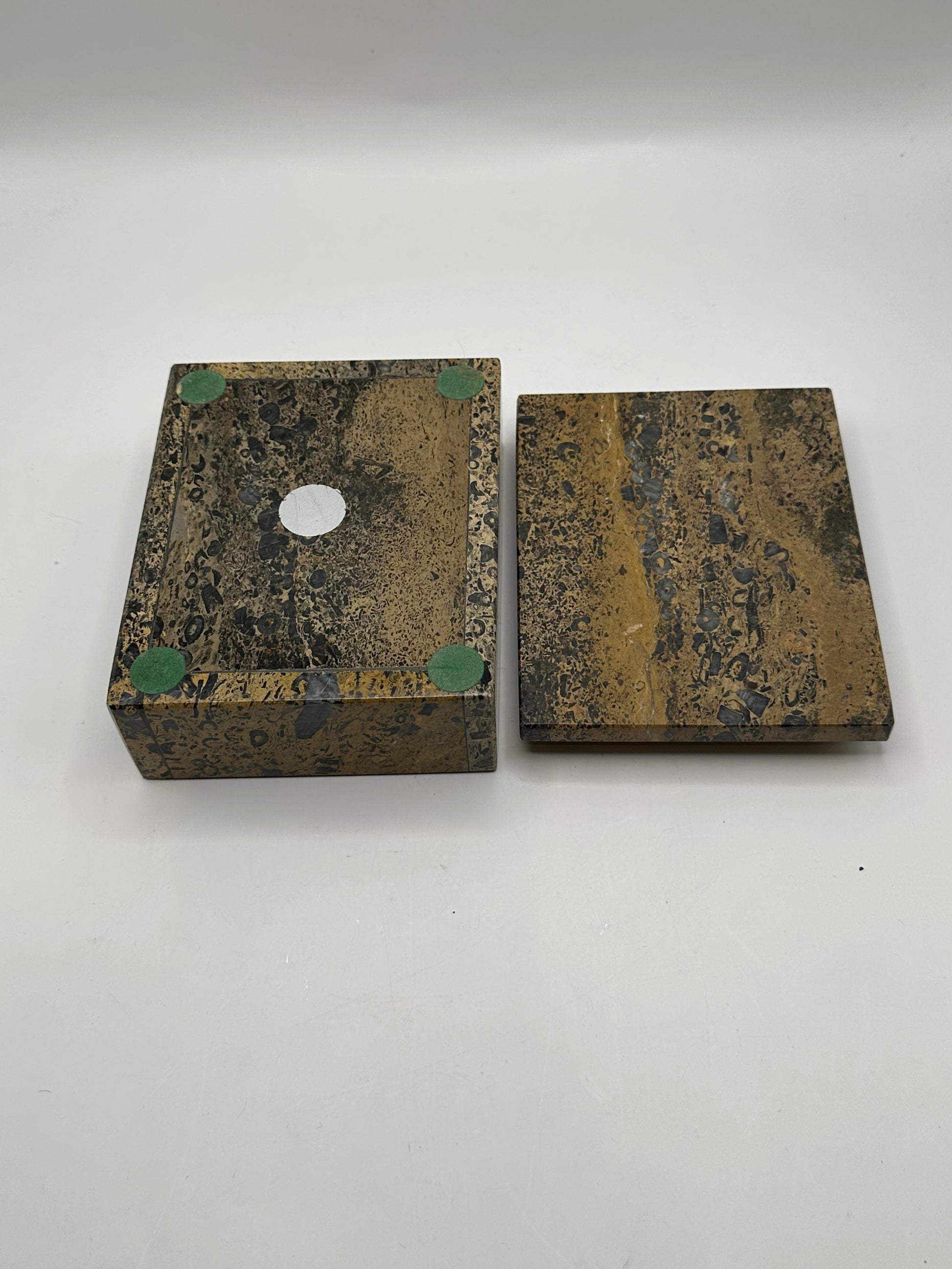 Brown stone box with lid removed beside it, showing felt foot pads on the underside