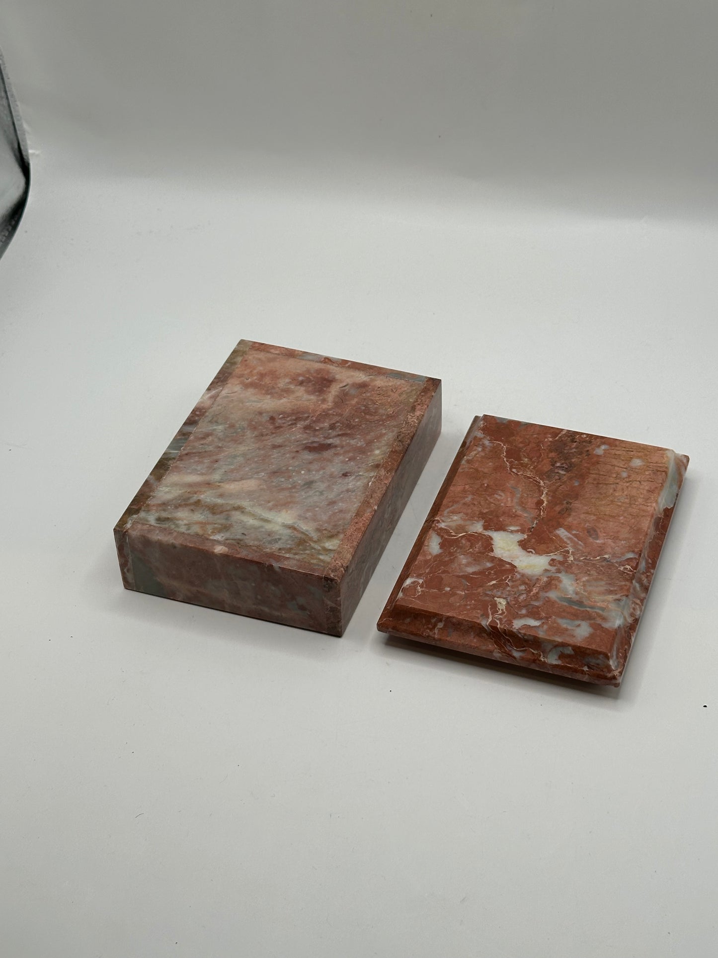 Rust marble box base and lid separated, showing polished surfaces