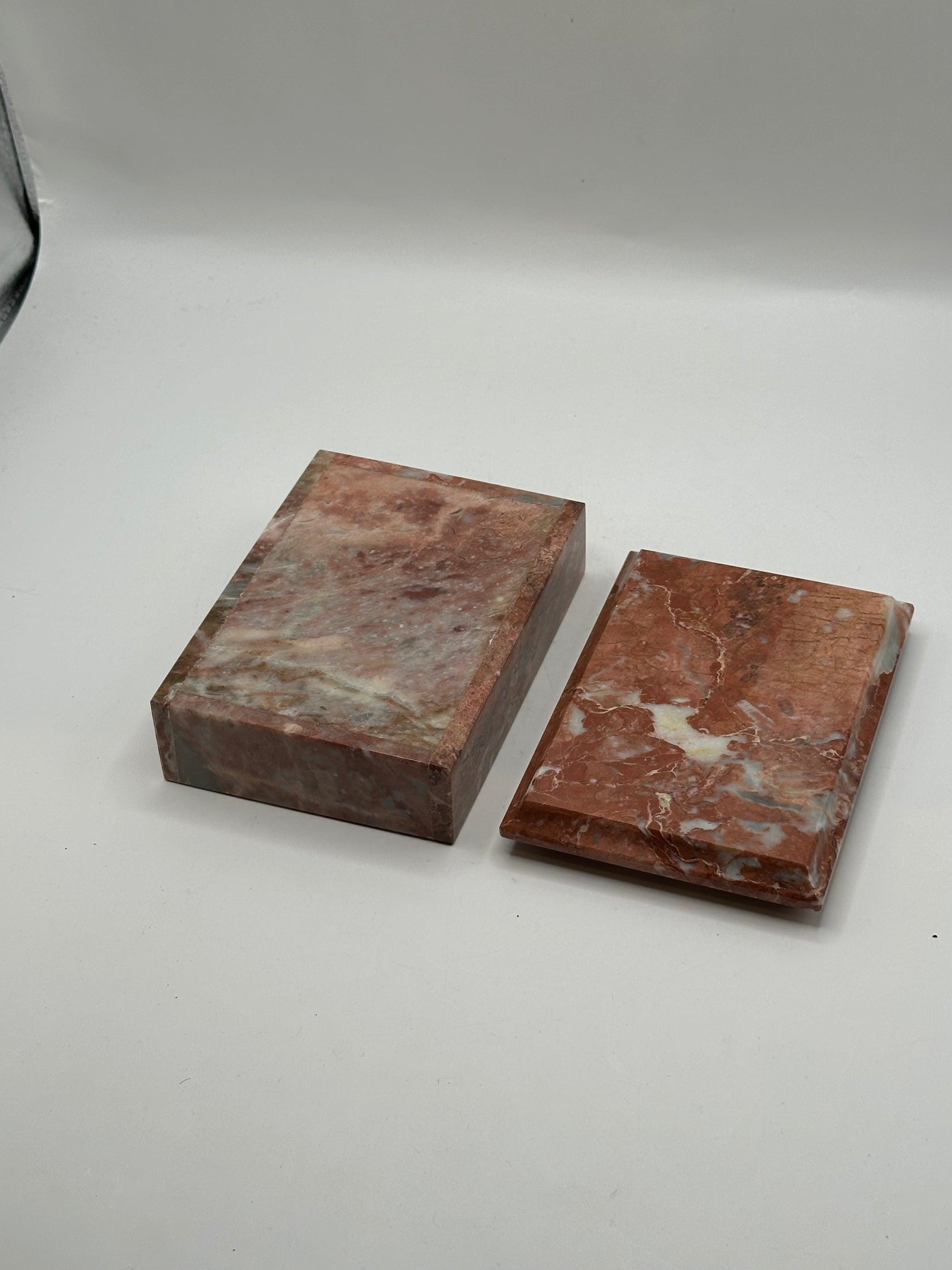 Rust marble box base and lid separated, showing polished surfaces