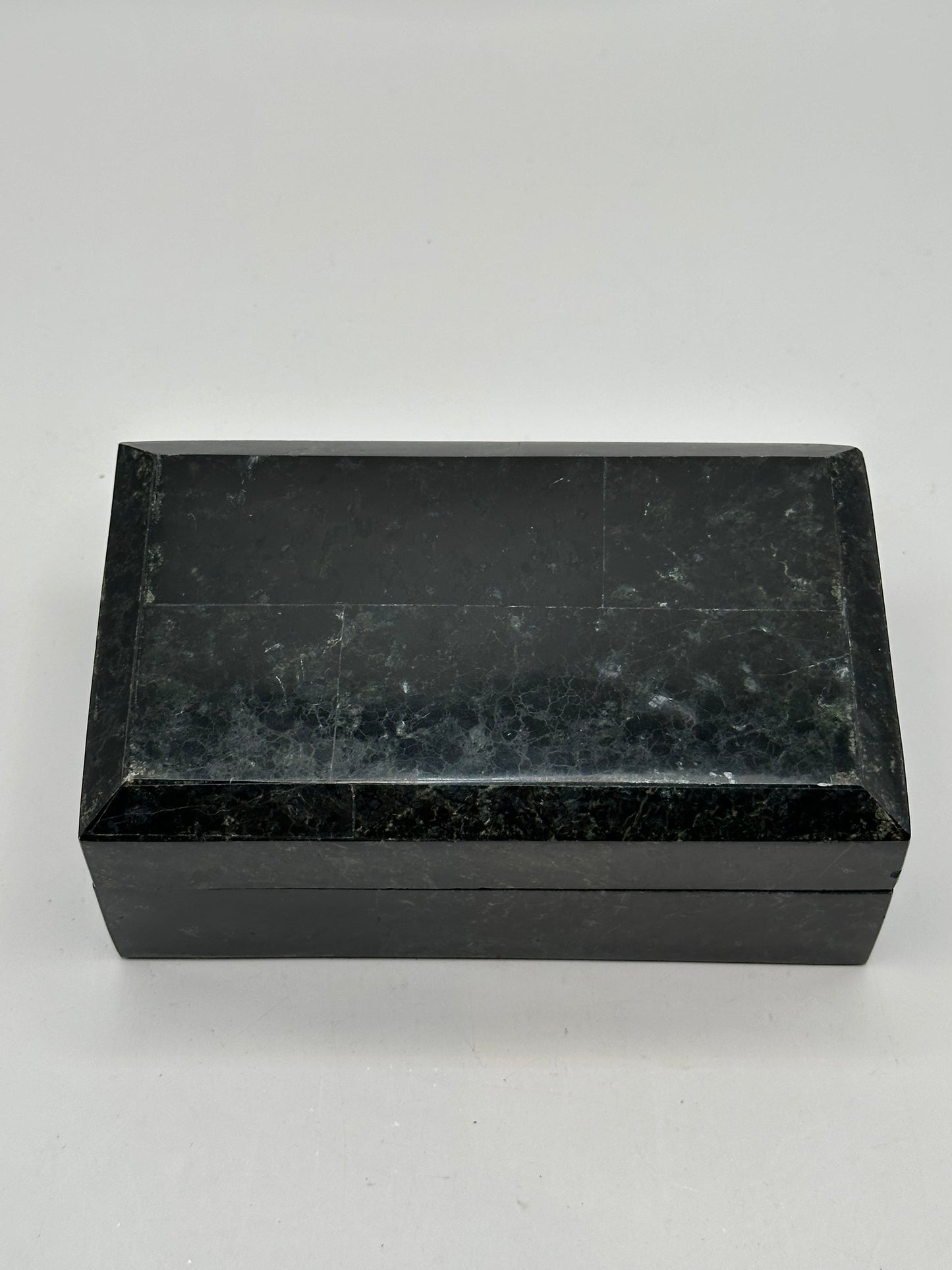 Open box lid showing the gold Renoir maker's label on black velvet