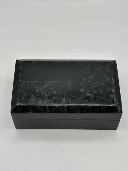 Open box lid showing the gold Renoir maker's label on black velvet