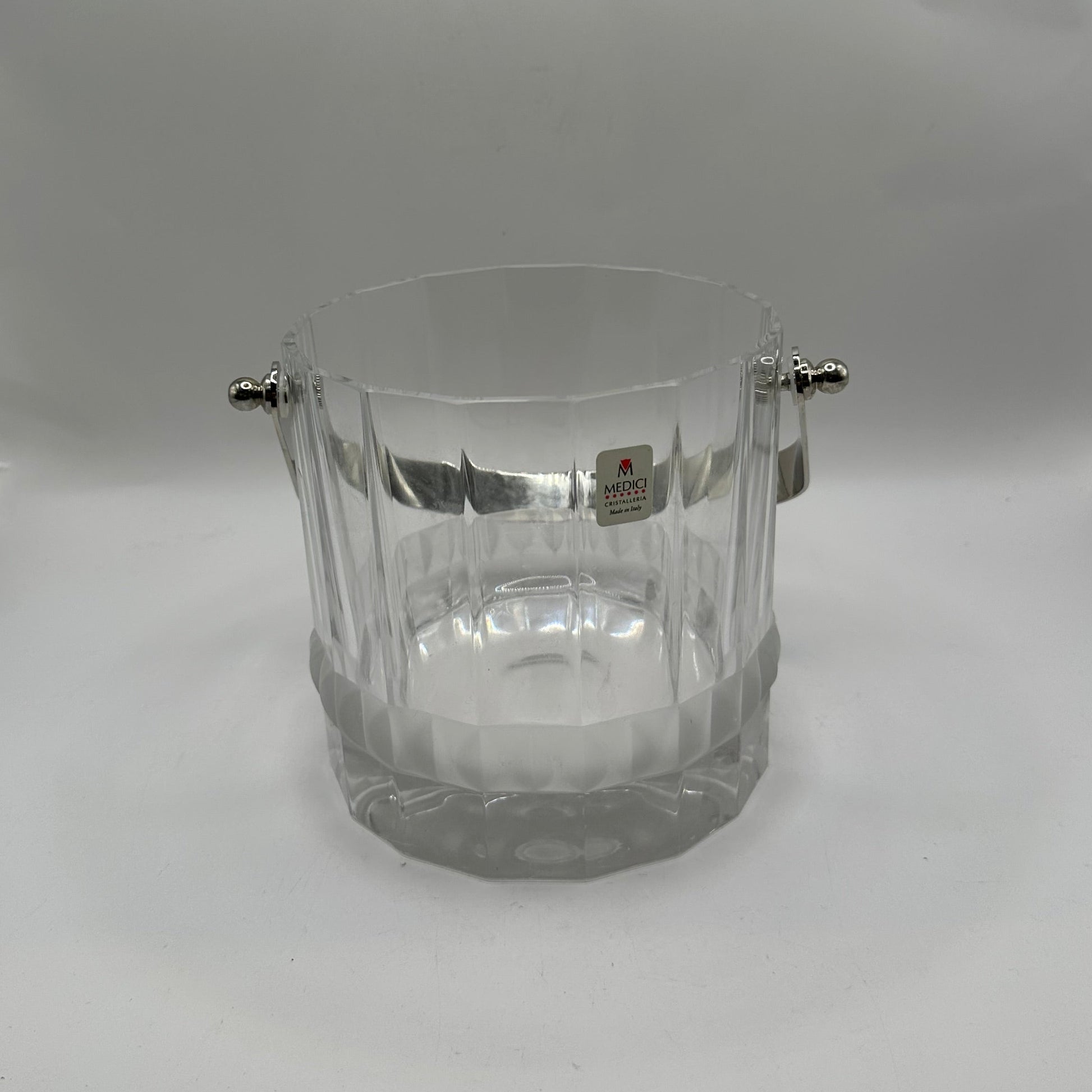 MCM crystal ice bucket, front view with handle raised and Medici Crystal Made in Italy label